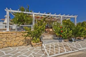 a building with trees and stairs in front of it at Villa Ntora in Afiartis