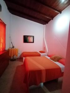 Rúm í herbergi á Hotel Cocos