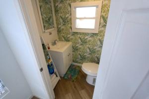 a bathroom with a toilet and a sink at Cozy Modern 3 bedroom Home in west Philly in Philadelphia