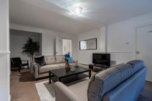 a living room with a couch and a table at The Wilton in Glasgow