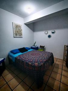 Rúm í herbergi á Hotel Cocos