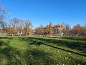 a large grass field with a large building in the background at Zagreb apartment Toni in Zagreb