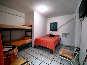 Postel nebo postele na pokoji v ubytování Hotel Cocos + 27 fotografií