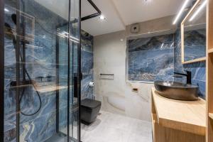 a bathroom with a sink and a shower at La Casa Kos Center with Jacuzzi in Kos +53 photos