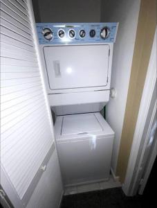 a white washer and dryer in a small room at Luxury Miami 2br Townhouse Near Stadium !! in Miami Gardens