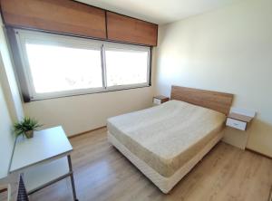 DAMCHE Vista al Mar tesisinde bir odada yatak veya yataklar