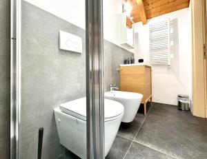 a bathroom with a toilet and a sink at The Loft in Timişoara +50 photos