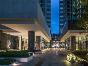 a building in a city at night at The Base Prime in Pattaya Central +60 photos