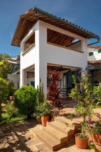 a house with plants in front of it at Posada del Campanario in Barichara
