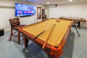 a pool table in a room with a tv at New: Dome, Hot Tub, Game Room, 5 min to park in Joshua Tree