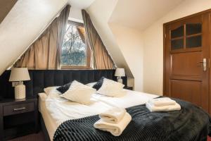 Posteľ alebo postele v izbe v ubytovaní Dworek pod Giewontem - Jacuzzi & Sauna