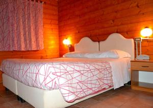 Postel nebo postele na pokoji v ubytování Agriturismo "Gli Olmi"