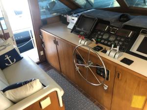 a view of the control room of a boat at Luxury Afloat Yacht Paradise 3 bedrooms 3bath 5 beds with full Marina view in Los Angeles