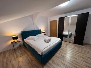 Katil atau katil-katil dalam bilik di Helix Apartaments