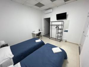 Postel nebo postele na pokoji v ubytování Hostal Kaizen