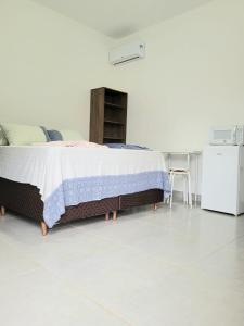 Vô Pedrinho客房内的一张或多张床位