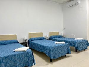 Postel nebo postele na pokoji v ubytování Hostal Kaizen