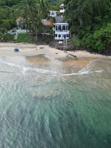 an aerial view of a beach with a house at Loft Playa Los Venados in Lo de Marcos +2 photos