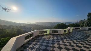 a balcony with a view of the mountains at The Star Resorts in Vagamon