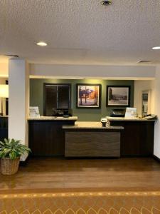 a lobby with a reception desk in a building at Woodmen Inn in Colorado Springs