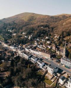 an aerial view of a city with a road and buildings at Cosy hillside cottage in Great Malvern