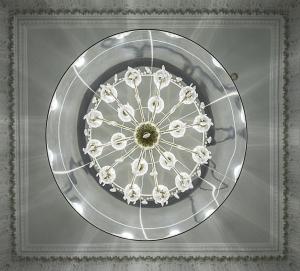 a chandelier in the ceiling of a room at Hospes Puerta de Alcalá, a Member of Design Hotels in Madrid