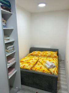 a small bedroom with a bed in a closet at Stan na dan - Foča in Foča
