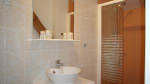 a bathroom with a sink and a shower at Maison Neuve Grandval in Grandval +27 photos