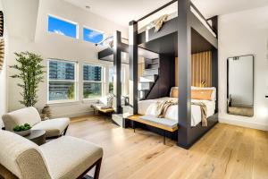 a bedroom with a bed and a mirror at Ellum House in Dallas