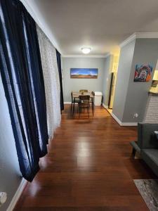 a living room with a table and a dining room at Blue Shark *E4* @ Midtown Comfortable 1BR King Apartment in Houston