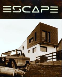 a truck parked in front of a house at ESCAPE in Petroşani