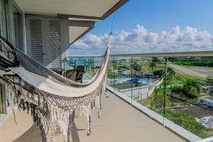 a hammock on the balcony of a house at Ocean-Confort in Cartagena de Indias