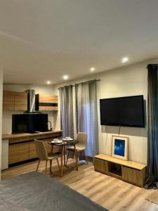 Телевизор и/или развлекательный центр в Chalet cosy et coconing