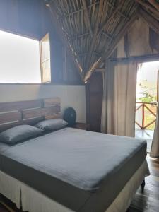Postel nebo postele na pokoji v ubytování Gecko Hotel