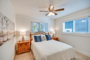 a bedroom with a bed and a ceiling fan at Beachfront Dadeville Family Escape on Lake Martin! in Dadeville