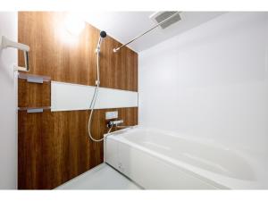 a bathroom with a shower and a white sink at VILLA KOSHIDO ODORI - Vacation STAY 04756v in Sapporo