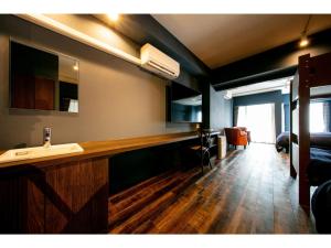 a bathroom with a counter and a sink in a room at VILLA KOSHIDO ODORI - Vacation STAY 04750v in Sapporo