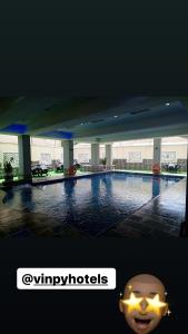 a picture of a swimming pool in a building at Vinpy hotels in Uyo