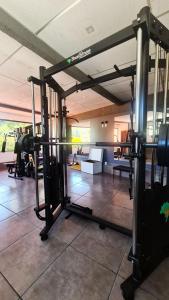 a fitness room with a gym with at Hotel Vila Nova in Teresópolis