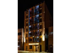 a tall building at night with the lights on at VILLA KOSHIDO ODORI - Vacation STAY 04775v in Sapporo