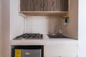 a small kitchen with a stove and a sink at affordable little private room, Polanco :) in Mexico City