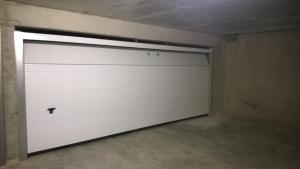 a garage door in a room with a ceiling at Vakantieappartement - Gratis garage - Topligging in Ostend +2 photos