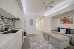 a kitchen and living room with a couch and a sink at KCM Tremont Oaks Apartments 1 in Cleveland