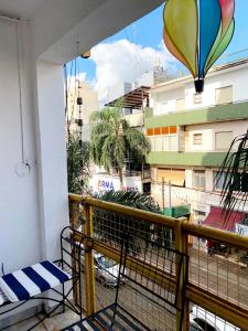 a balcony with a view of a city with a hot air balloon at Posadas Aloja in Posadas