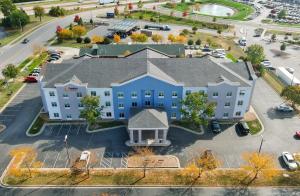 an aerial view of a large building with a driveway at Comfort Suites Kansas City - Liberty in Liberty