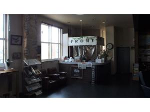 a front desk of a store with a sign that reads front at GUEST HOUSE MASAGO - Vacation STAY 13810v in Urakawa +5 photos