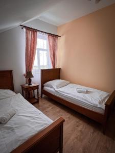 Postel nebo postele na pokoji v ubytování Hotel Lony