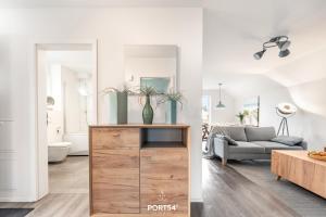 a living room with a couch and a table at Ferienwohnung Nicks Seestern Olpenitz in Olpenitz