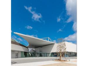 a building with a blue sky in the background at Zentsuji Grand Hotel - Vacation STAY 16623v in Zentsuji