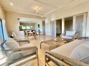 a living room with chairs and a table at Yoronto - Vacation STAY 18850v in Yoron